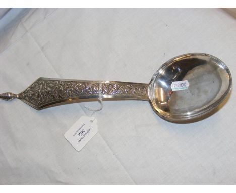 An Indian silver ladle - 32cm long 