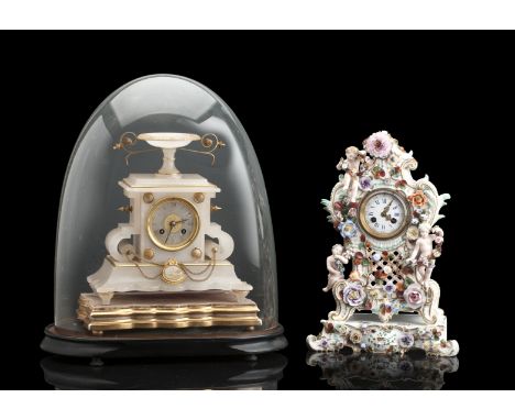 A 20TH CENTURY GERMAN GILT PORCELAIN MANTLE CLOCKThe floral encrusted case modelled with putti holding floral garlands, the c