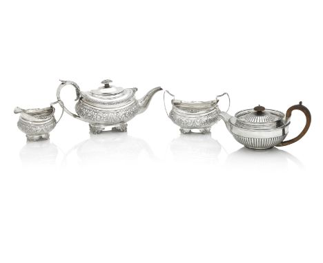 A GEORGE III THREE PIECE SILVER TEA SETLondon 1819Of rounded rectangular form cast and embossed with foliate and acanthus ban