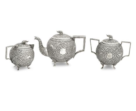 A THREE PIECE INDIAN SILVER TEASET19th centuryEach piece of spherical form, densely chased with animals and foliage and with 