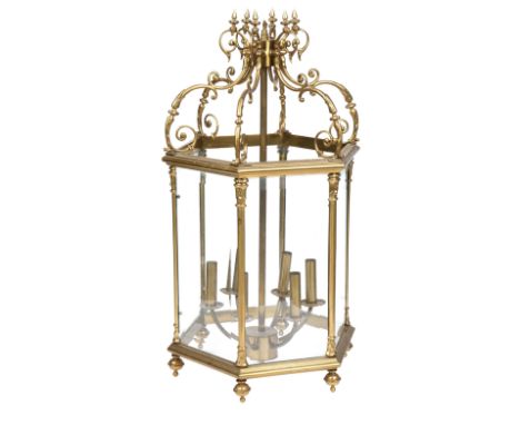 A BRASS SIX-LIGHT HALL LANTERN20th centuryThe octagonal frame with clear bevelled glass panels, beneath a double c-scroll ope