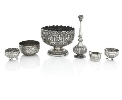 A BURMESE SILVER PUNCH BOWLApparently unmarkedOn pedestal foot, chased with a band of dancers, diameter 22.5 cm; together wit