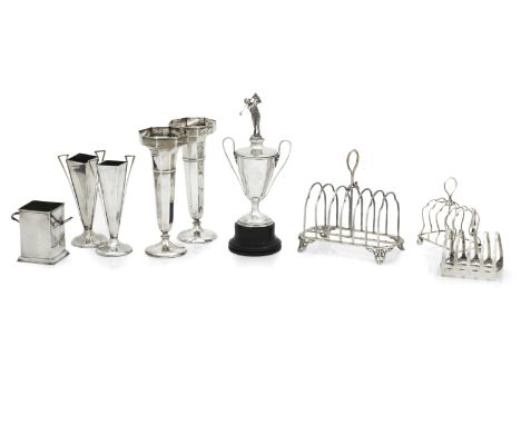 A VICTORIAN SILVER TOAST RACKJohn Gilbert &amp; Co, Birmingham 1857 On four open scroll feet, with seven wirework divisions a