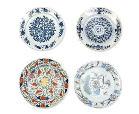 A GROUP OF FOUR DELFTWARE CHARGERS,18th century,Comprising two Dutch  blue and white examples, painted with flowers,  a Dutch