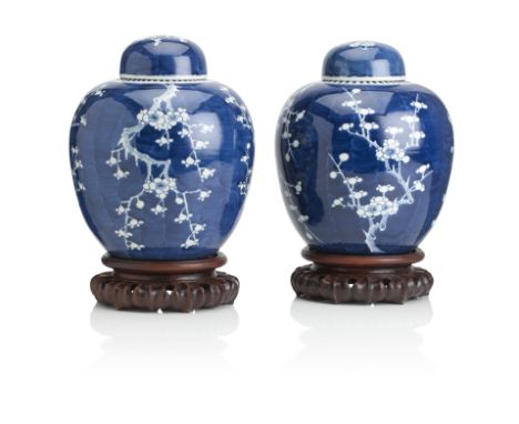A PAIR OF CHINESE BLUE AND WHITE GINGER JARSQing DynastyEach painted with branches of prunus blossom on a blue ground, with d