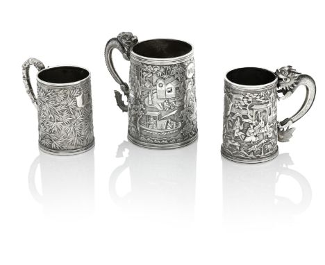 THREE CHINESE EXPORT SILVER MUGS19th centuryBy first by KHG, and with pseudo Georgian hallmarks, chased with a battle scene a