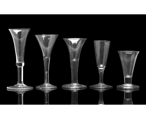 A GROUP OF WINE GLASSES,18th centuryIncluding a baluster cordial with folded foot, 17.8cm high, an ale glass with waisted bow