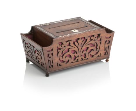 A REGENCY ROSEWOOD LETTER BOXOf rectangular form, with fret-cut scrolling foliate pieced sides, the hinged lid inlaid with mo