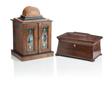 A VICTORIAN WALNUT AND EBONISED TABLE CABINETWith arched caddy top above two doors fitted with reverse painted panels of a li