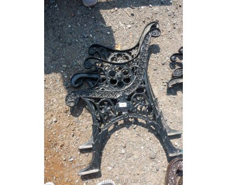 A pair of of cast iron bench, black painted.