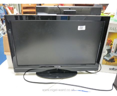 A Toshiba flat screen TV, 21".