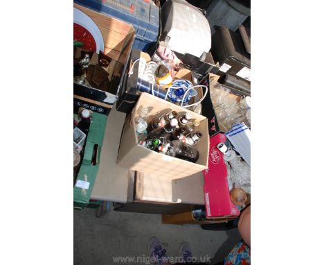 Two boxes, one containing old beer bottles and the other with china and glass, toast racks, lemon squeezer, electric knife sh