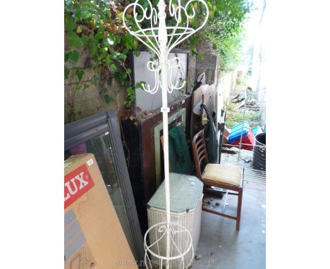 A white painted metal coat stand and stick.