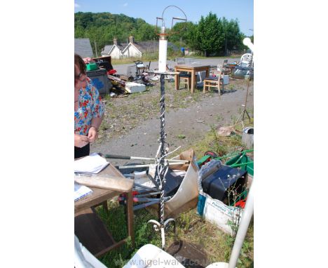A wrought iron standard lamp/light.