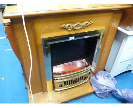 An electric coal effect fire and surround.