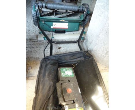 A rechargeable lawn mower with roller, two batteries, no charging unit.