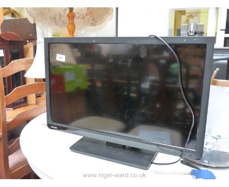 A Toshiba flat screen TV, 22 1/2".
