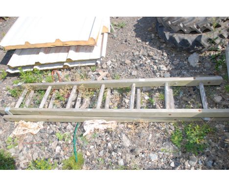 An extending wood ladder, 14 rungs.