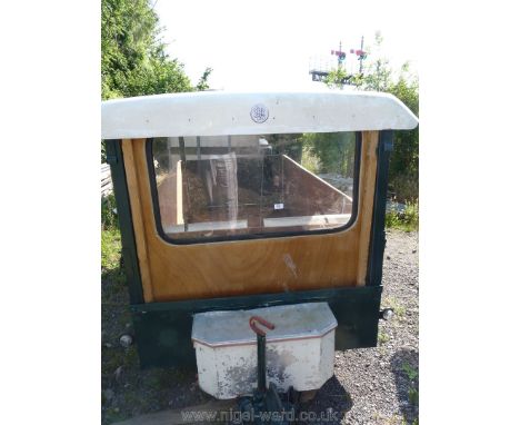 A single axle trailer with roof cover and windscreen, possibly suitable for tractor road run use. 
