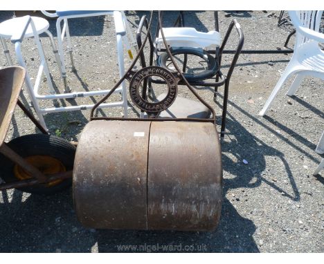 A heavy "Monarch Water Ballast" garden roller, handle a/f.