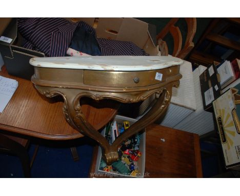 A small gilt and white painted console table.