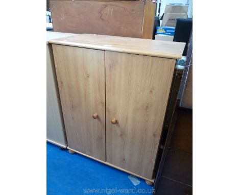 A light-Oak wood-grain finished cupboard with shelves within.