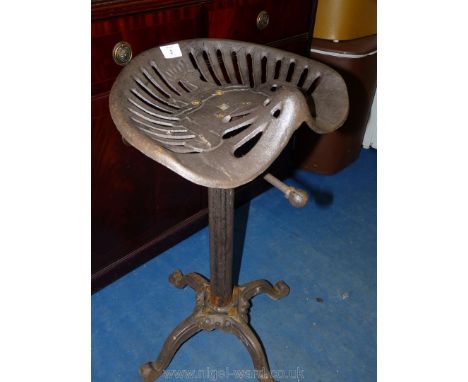 A cast iron tractor seat Stool. 