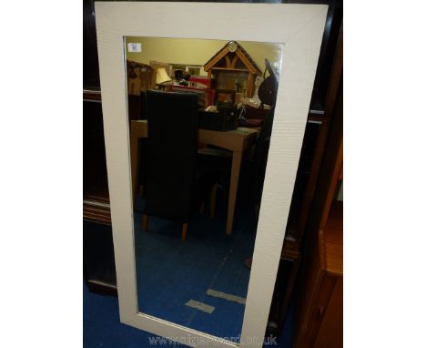 An Ikea wall mirror with painted white surround 46 1/2" tall x 23".