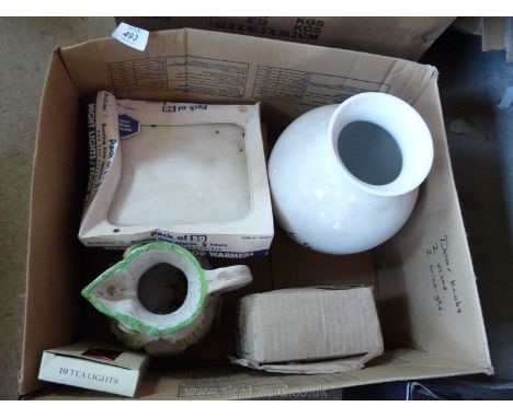 A box of miscellanea including vase jug, set of night light candle holders.