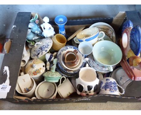 A box of miscellaneous china, cups, jugs, candlestick ornaments etc.
