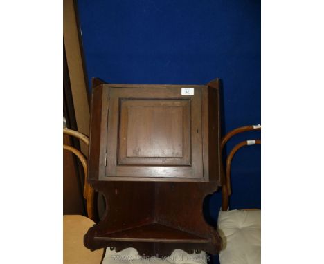 A small Mahogany wall-hanging corner cupboard unit with shelf.