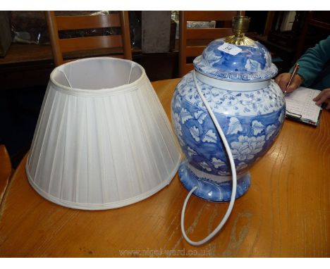 A blue and white lamp and shade.