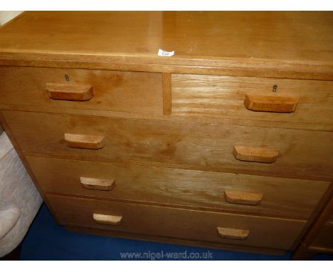 A light Oak chest of three long and two short drawers, 42" long x 19" wide x 38" tall.