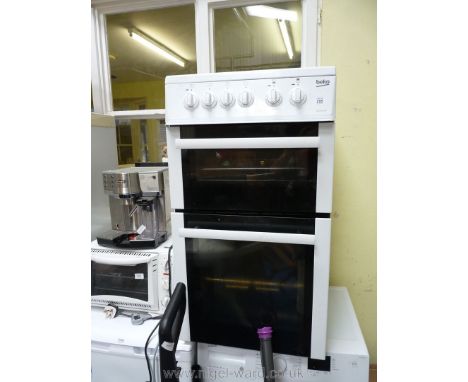 A Beko used condition slimline electric cooker with ceramic top.