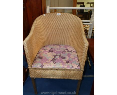 A wicker commode chair.