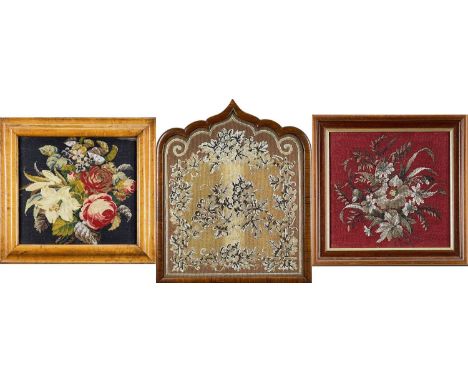 THREE VARIOUS VICTORIAN BEADED WOOLWORK PANELS, floral decorated, including one formerly a firescreen in arched frame, larges