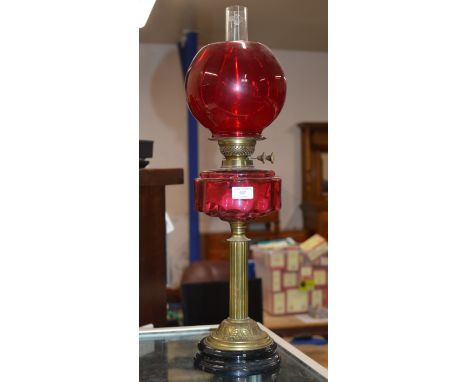 COLUMNED DOUBLE BURNER PARAFFIN LAMP WITH CRANBERRY GLASS RESERVOIR, COLOURED GLASS SHADE &amp; GLASS FUNNEL     