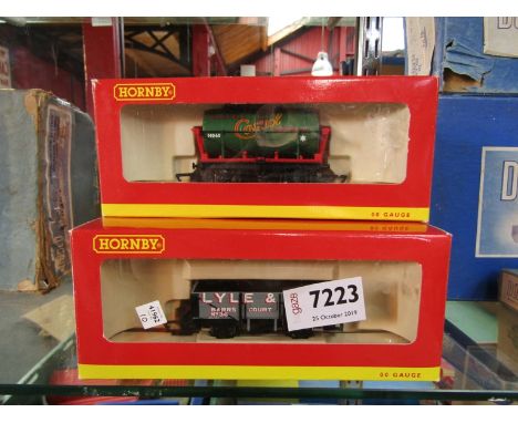 Nine boxed items of Hornby 00 gauge rolling stock including 'Castrol' tank wagons and 'Lyle &amp; Son' 5 plank wagons etc