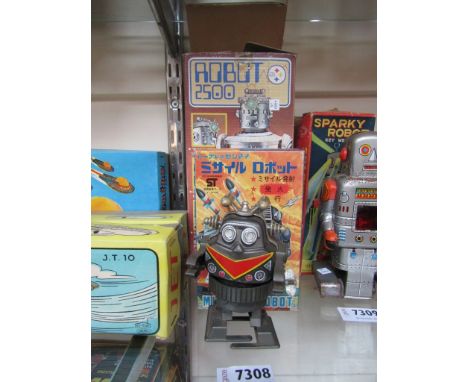 A boxed Durham Industries Robot 2500, un boxed Yone of Japan tinplate and plastic robot, boxed ST of Japan Mechanical Missile