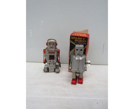 A boxed KO Japan tinplate Sparky Robot and an unboxed SY toys sparking robot 