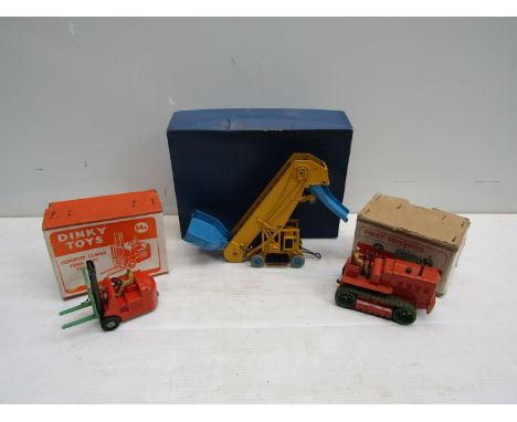 Three boxed Dinky diecast vehicles to include No. 563 Heavy Tractor, No. 14c Coventry Climax Fork Lift Truck and No. 564 Elev