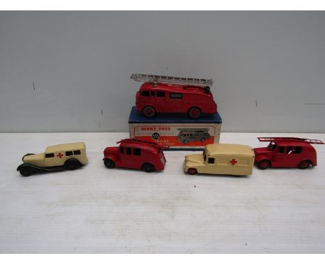 A boxed Dinky diecast 555 Commer Fire Engine and four unboxed Dinky emergency vehicles including Daimler Ambulance, Fire Engi