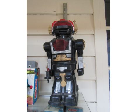 A battery powered plastic robot toy 