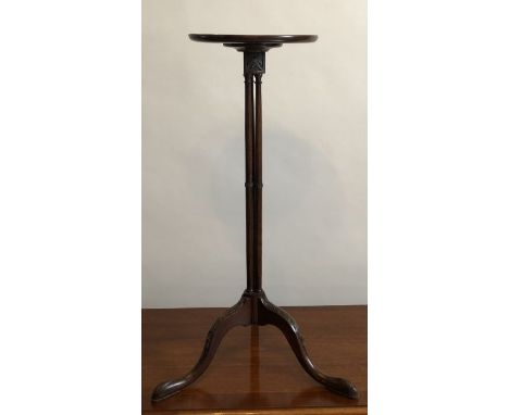 An Edwardian mahogany candlestick stand, with a dished Georgian mahogany top supported on three central column, all raised on