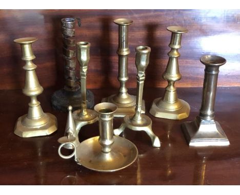 A collection of brass candlesticks, of varying styles and age, together with a brass chamber-stick (8)