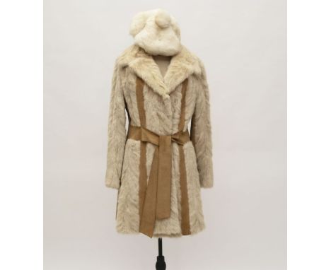 1960s/70s chevron set mink coat with suede inserts and integral belt. The coat is lined with satin. This is a great quality p
