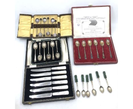 Two sets of six silver coffee spoons, a set of six bean end coffee spoons, a set of six tea knives with with mother of pearl 