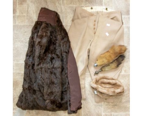 A straw boater hat, an acrylique French faux fur hat, and a fur coat and a vintage pair of jodphurs.&nbsp;