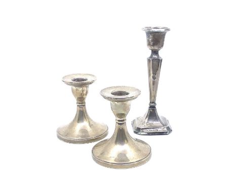 Two silver weighted dwarf candlesticks, 8.5cm tall, hallmarked Chester, 1930 together with a single George V small candlestic