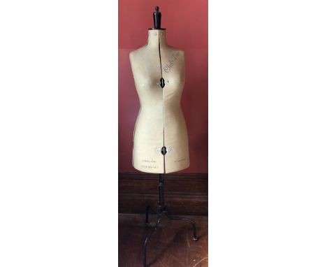 An early 20th century Chil-daw adjustable mannequin, adjustable bust and waist, raised on a tripod base 160cm tall&nbsp;